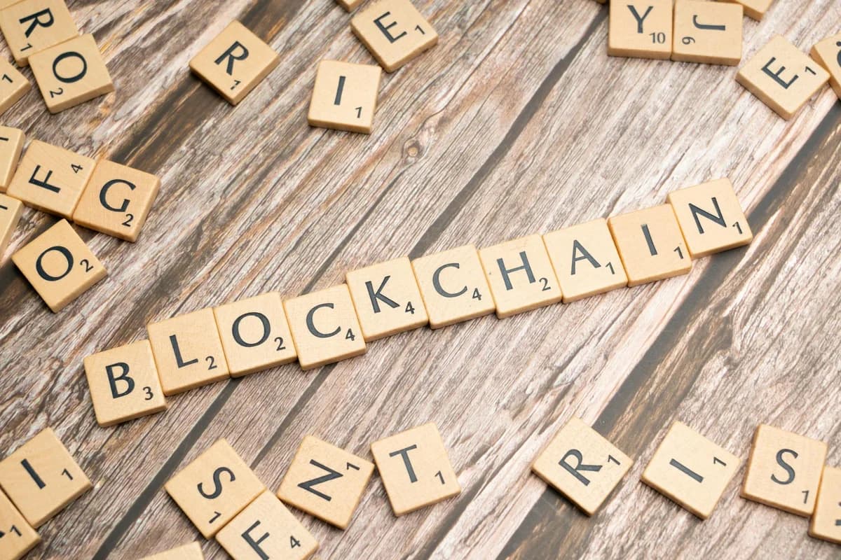 Laptop with blockchain application interface connecting. Ideal for tech and crypto themes.