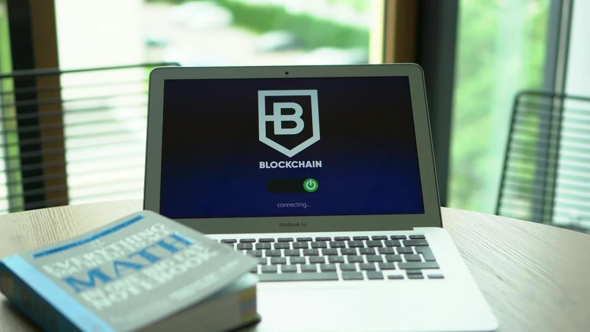 Top view of a modern digital workspace with blockchain theme essentials.