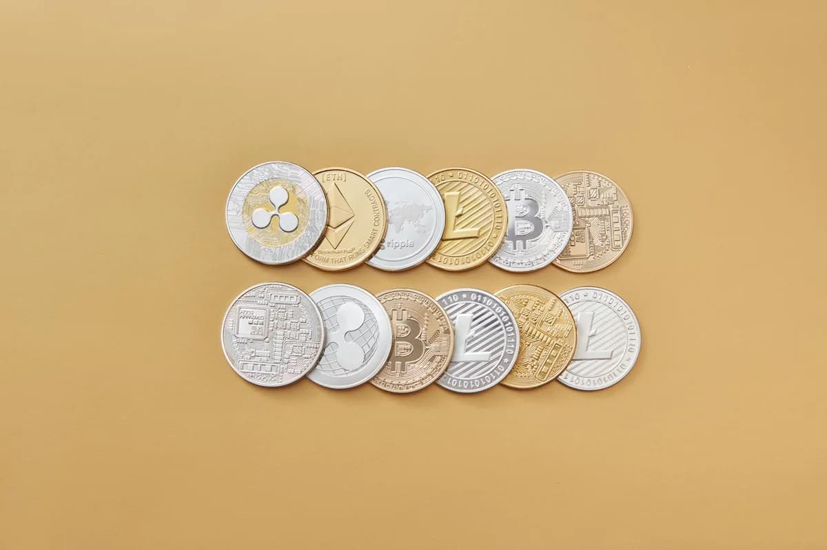 Close-up of Ethereum and Bitcoin coins symbolizing cryptocurrency and blockchain technology against a purple backdrop.