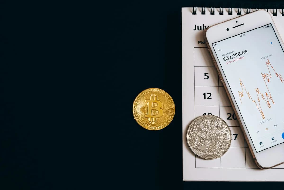 Gold bitcoins stacked on a laptop keyboard symbolizing digital currency and blockchain technology.