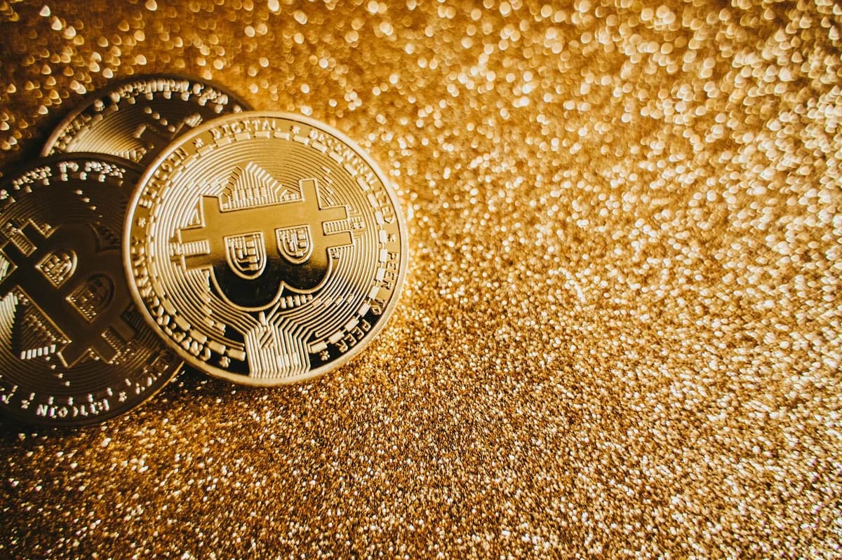 Golden Bitcoin displayed prominently on a white background showcasing cryptocurrency value.