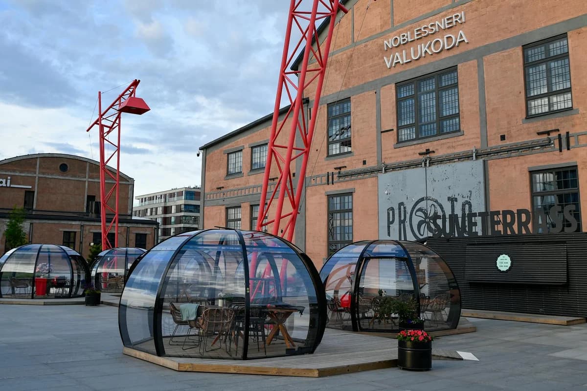 Modern dining domes at Noblessner with industrial architecture in Tallinn, Estonia.