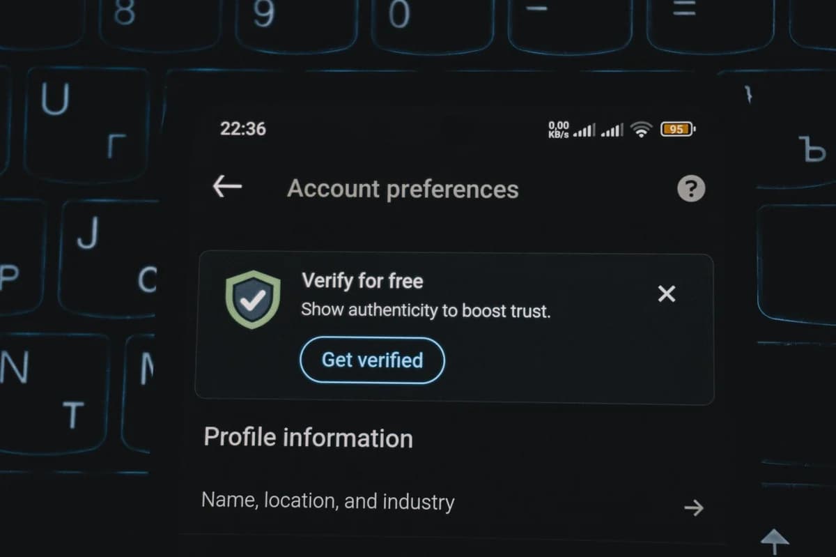 Close-up of a smartphone screen displaying account verification alert. Ideal for security and authenticity themes.