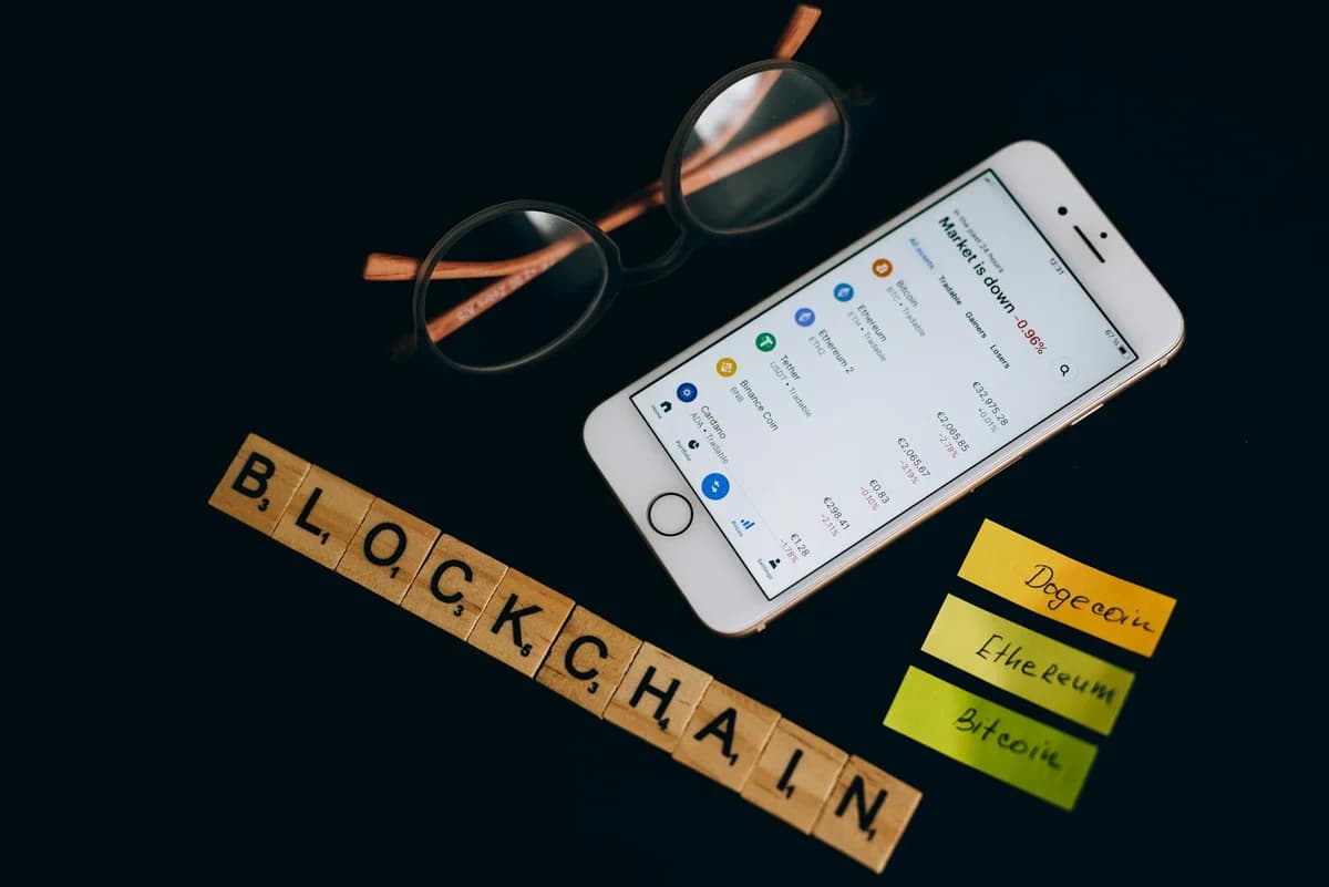 A collection of digital cryptocurrency coins, including Bitcoin and Ethereum, arranged on a stylish gold backdrop.