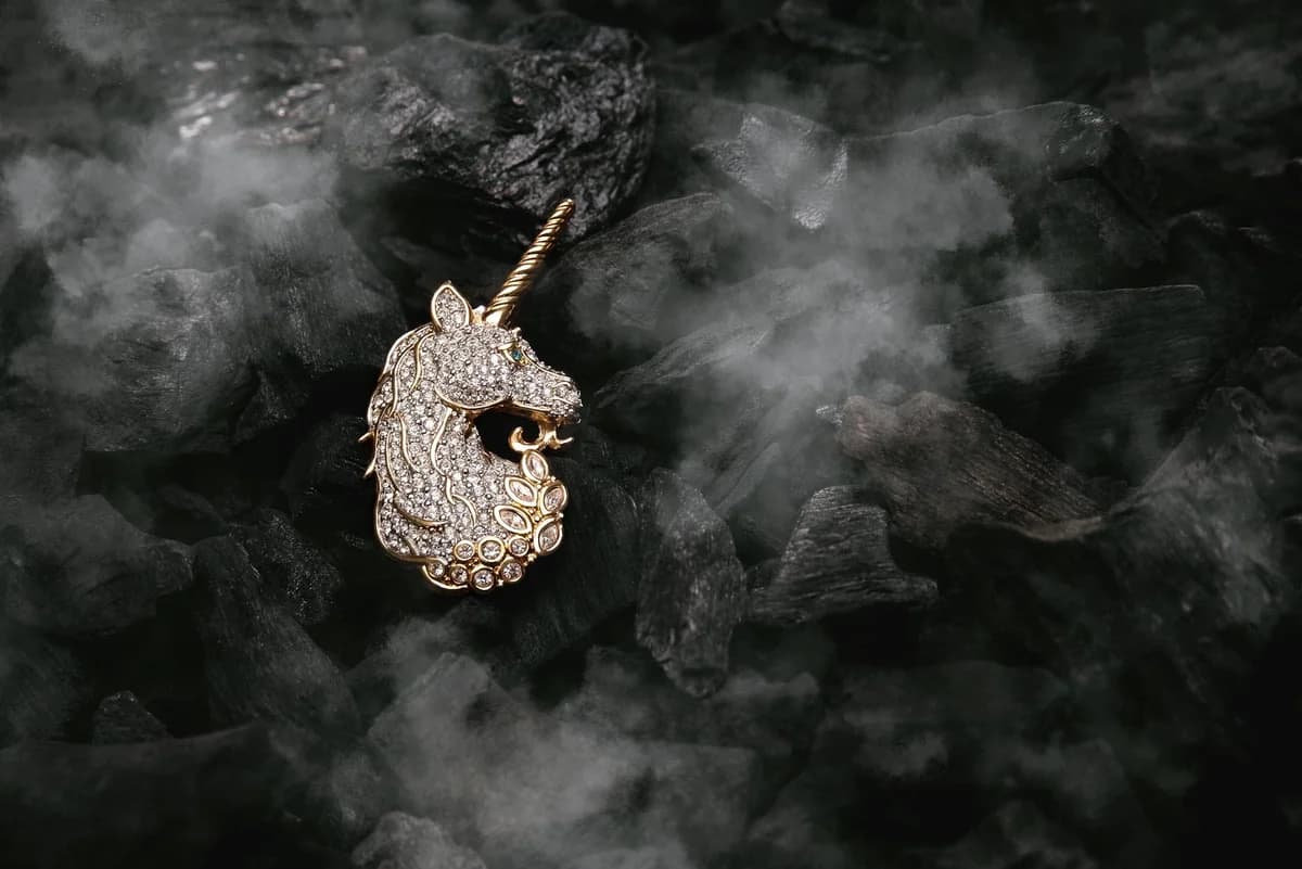 A metal hook suspended in a workshop with dramatic cinematic lighting.