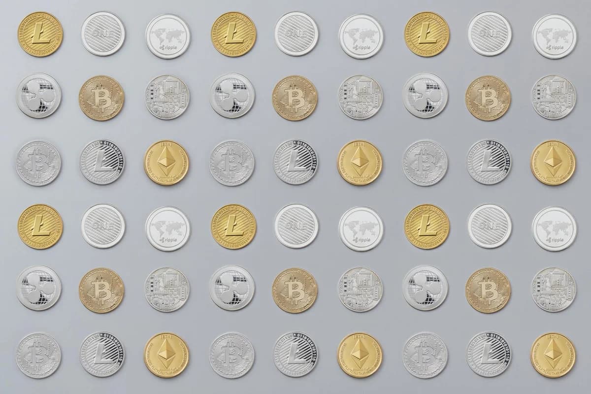 A seamless pattern of various cryptocurrency coins in gold and silver tones.