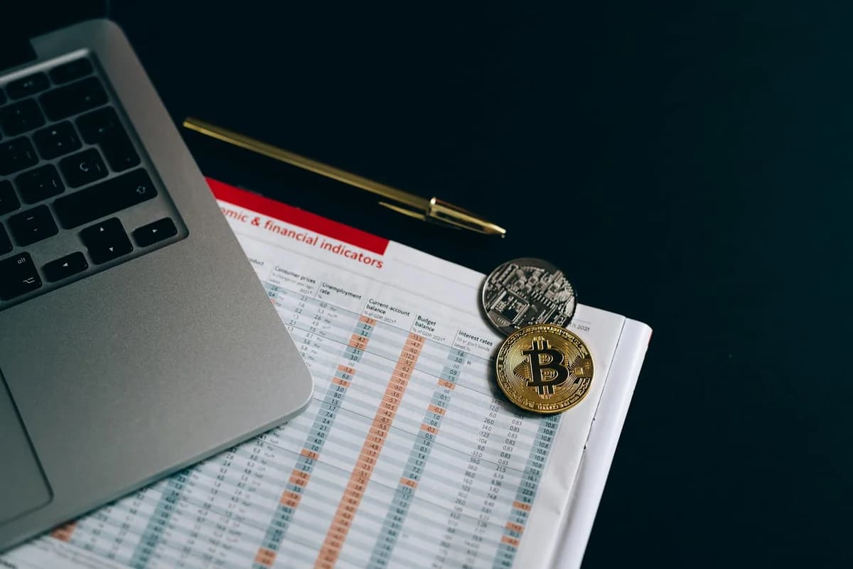 Digital currency coins on a paper chart, showcasing financial growth insights.