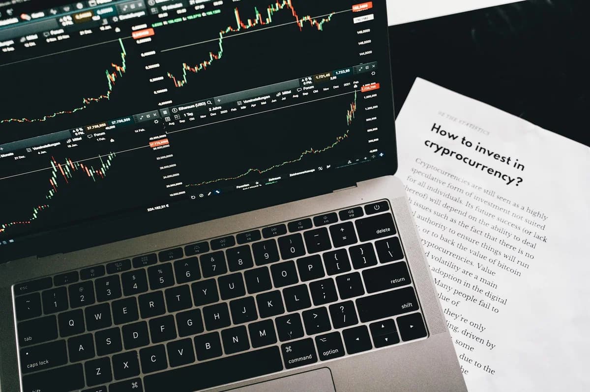 Business theme with stock market document, currency, and mobile display.
