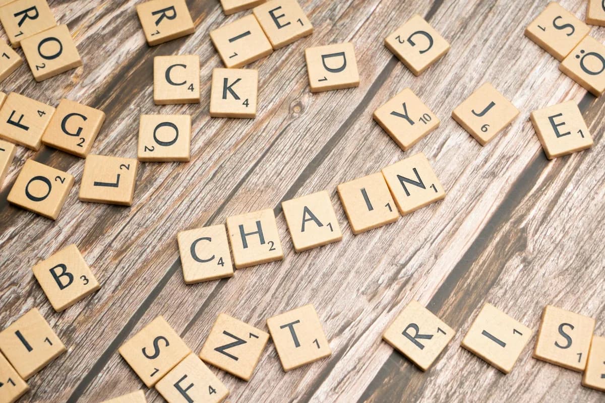 A collection of wooden letter tiles forming words on a rustic wooden surface. Ideal for word game concepts.