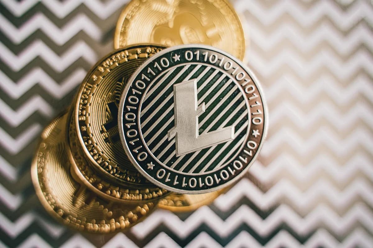 Close-up of a Bitcoin cryptocurrency coin on a vibrant yellow background, symbolizing digital money.