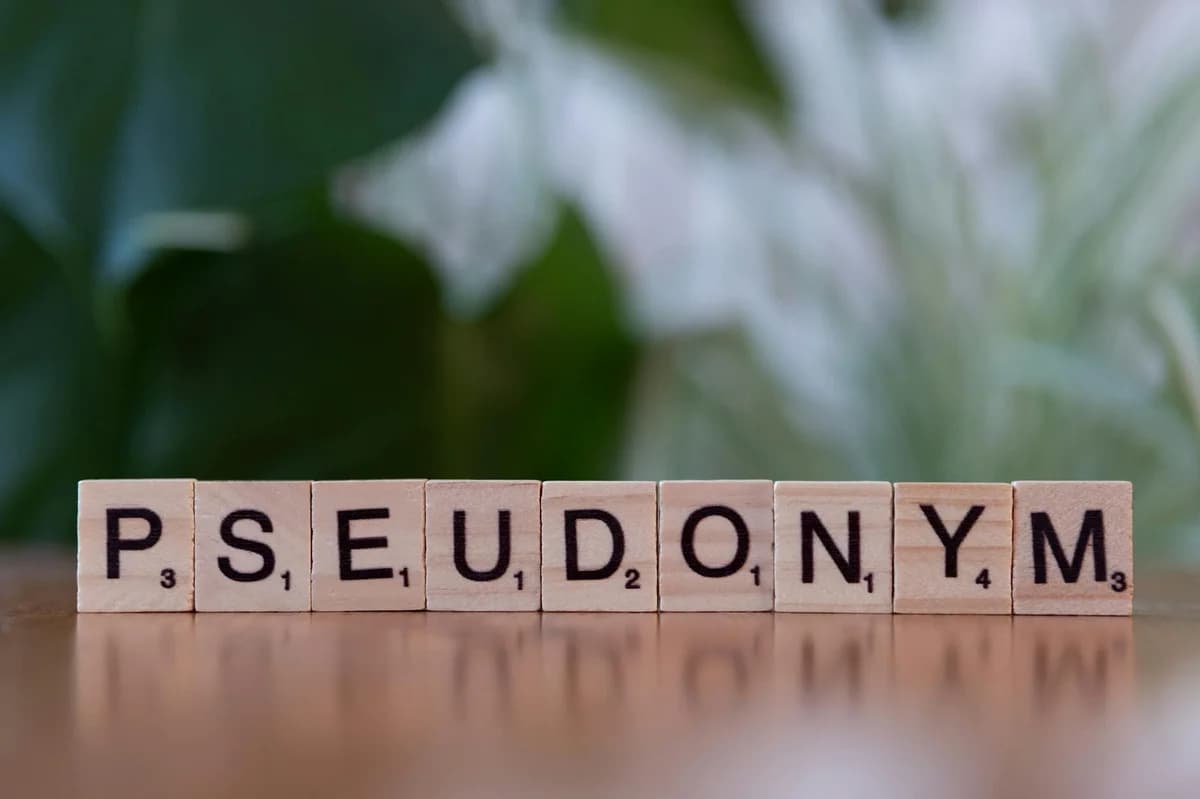 Scrabble tiles spelling 'TRIP' on a pink background, perfect for travel themes.