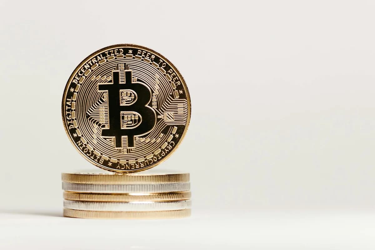 Golden Bitcoin displayed prominently on a white background showcasing cryptocurrency value.