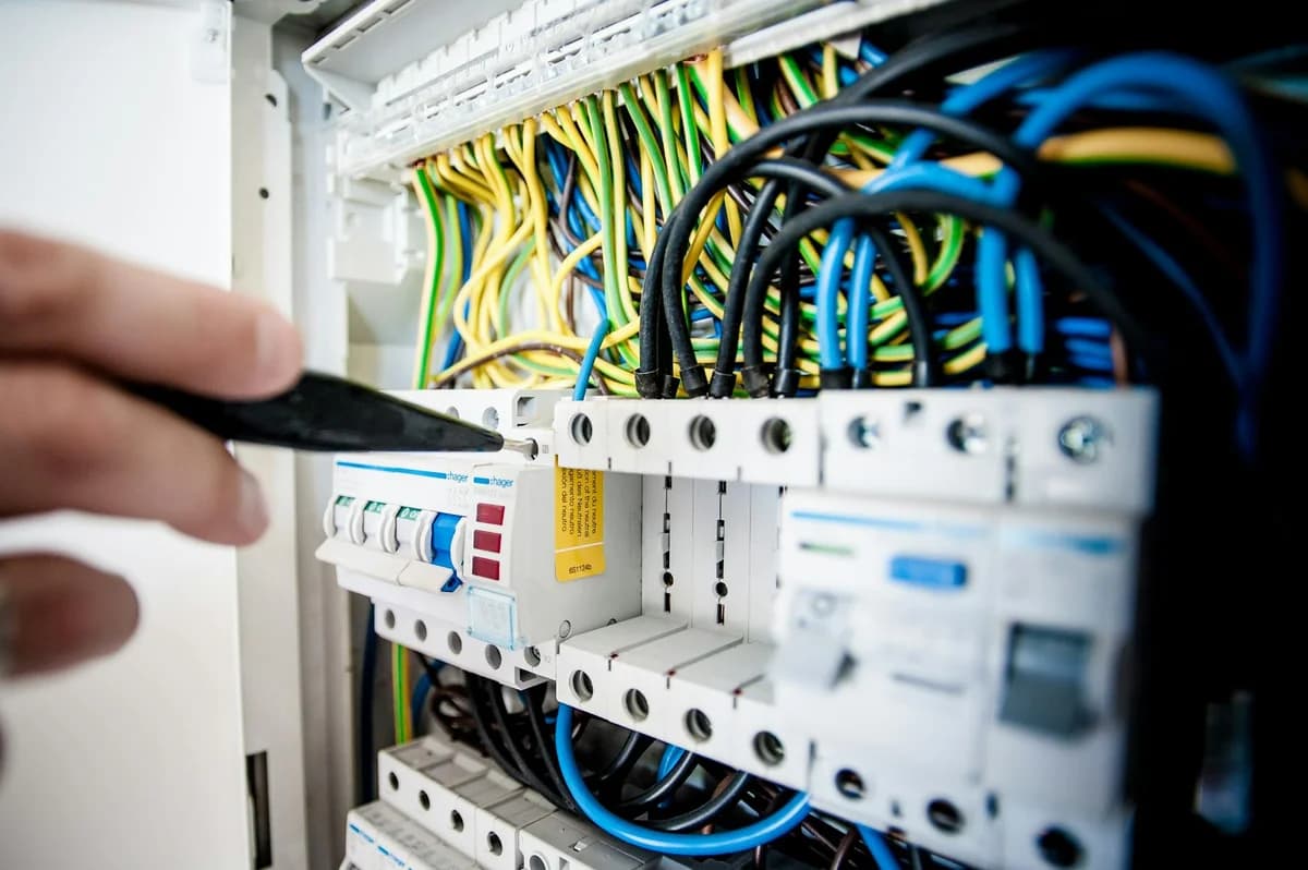 Close-up view of electrical relays in an industrial panel box showcasing circuit components.
