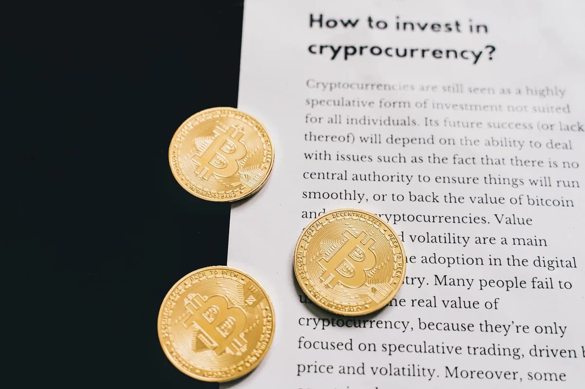 A detailed look at cryptocurrency market trends using a laptop and analytical document.