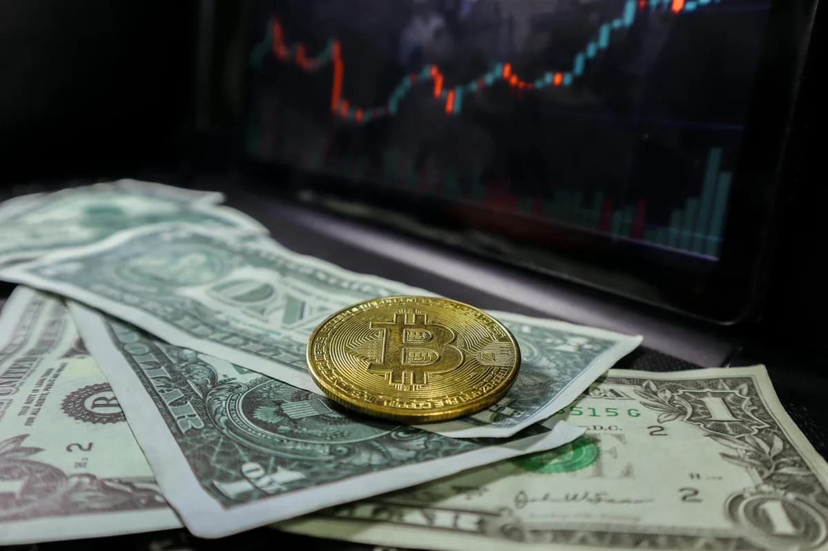 Close-up of bitcoins and US dollar bills symbolizing modern finance and cryptocurrency.