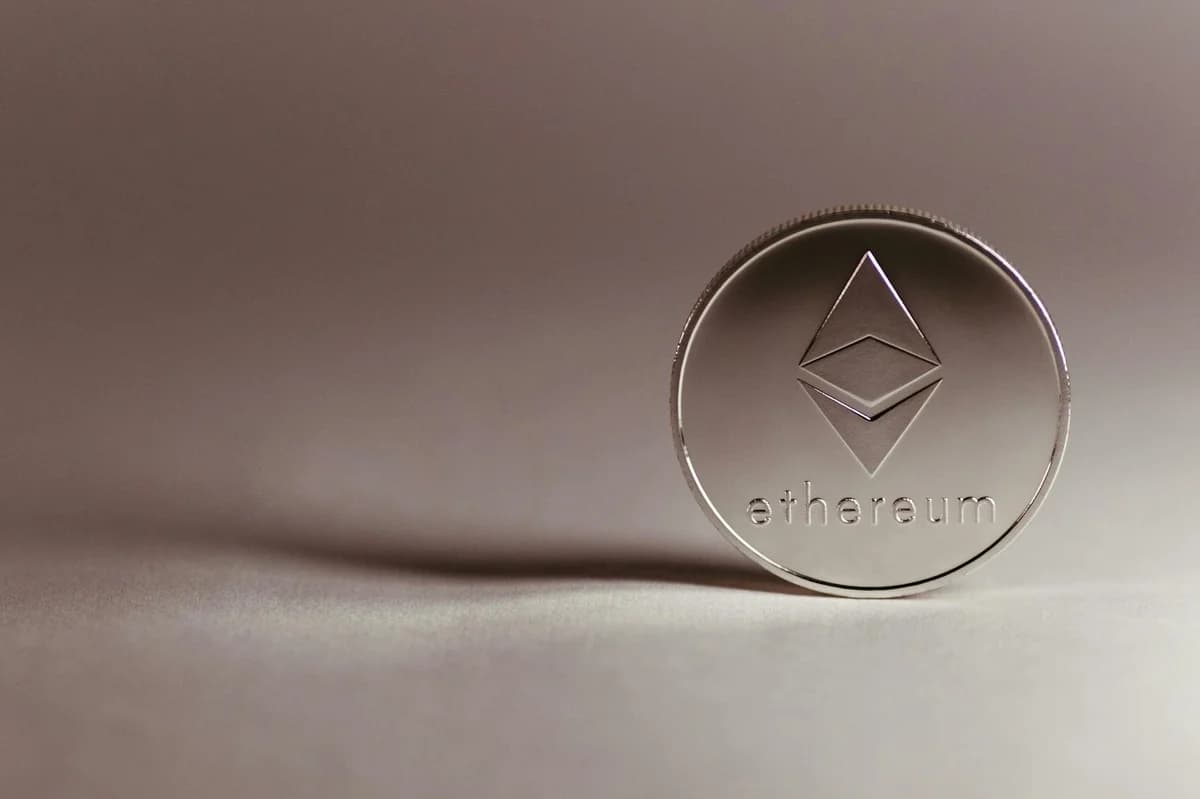 Close-up of a transparent Ethereum coin symbolizing blockchain technology and modern finance.