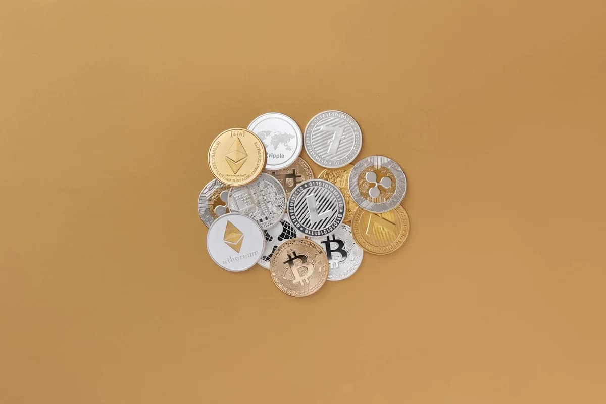 A cluster of cryptocurrencies including Bitcoin, Ethereum on a subtle background symbolizing digital finance.
