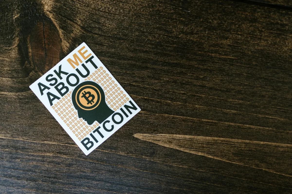 Closeup of bitcoin coins buried in soil, symbolizing digital currency and investment growth.