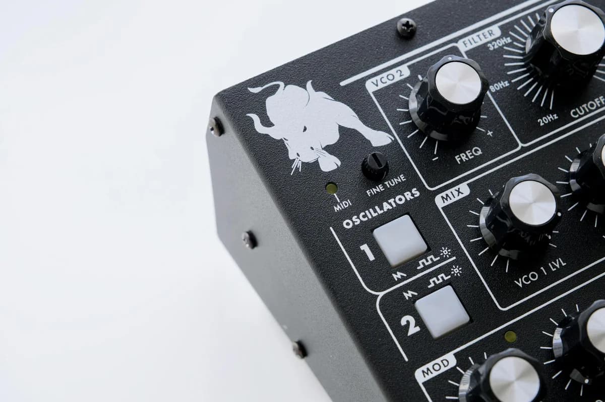 Detailed view of a synthesizer with knobs and oscillators, showcasing electronic music equipment.