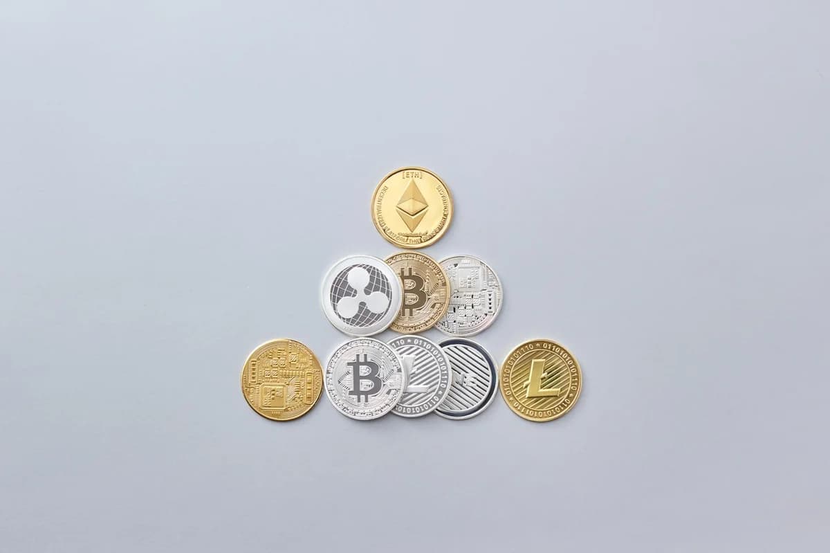 Close-up of a Bitcoin cryptocurrency coin on a vibrant yellow background, symbolizing digital money.