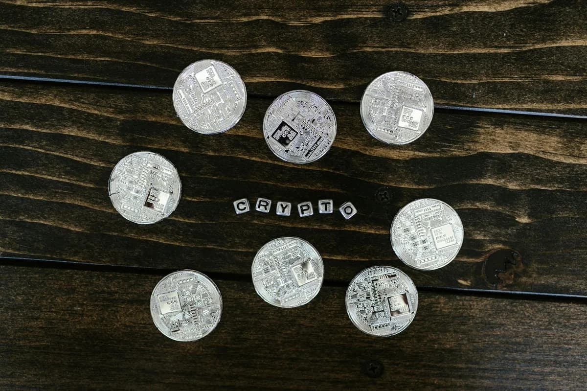 A detailed close-up shot of shiny bitcoin coins resting on a glittery surface, symbolizing wealth in digital currency.