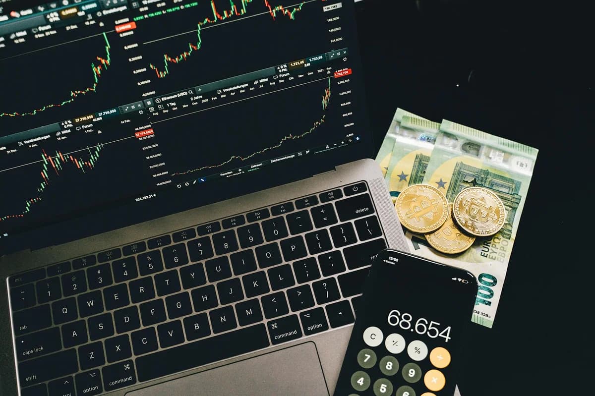 Best DeFi Platforms for Beginners: Top Picks Gold Bitcoin coin with blurred financial chart in background, representing cryptocurrency trading.