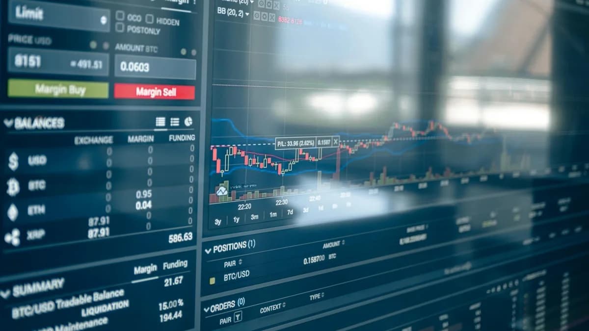 Spot Trading vs Futures Trading: Crypto Basics Close-up of a digital screen displaying stock trading graphs and cryptocurrency values. Ideal for finance and technology themes.